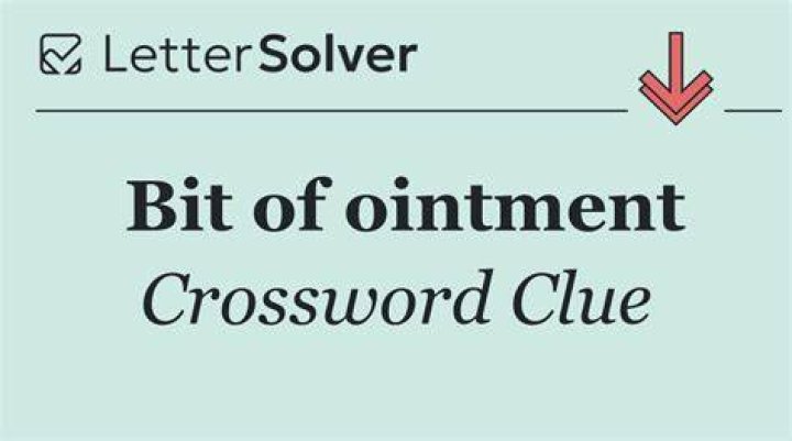 Little bit, as of ointment Crossword Clue